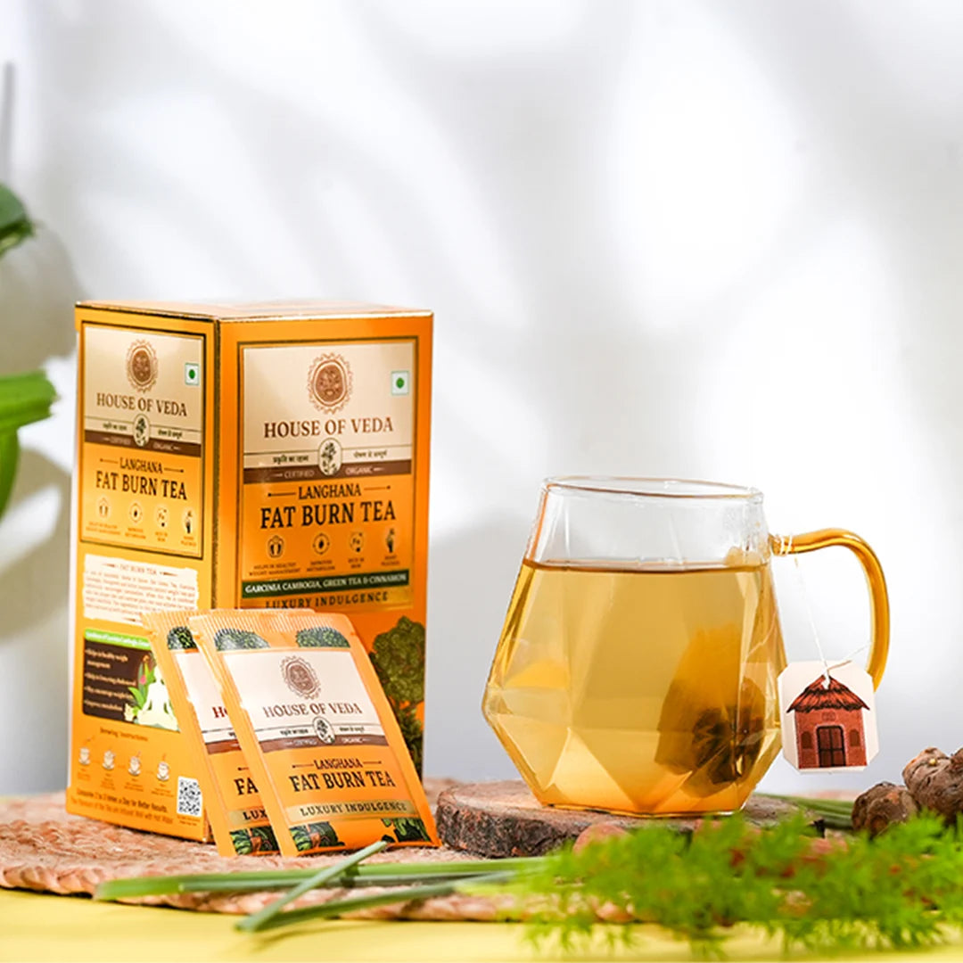House of Veda Lagnana Fat Burn Tea packaging with a glass of tea on a natural background
